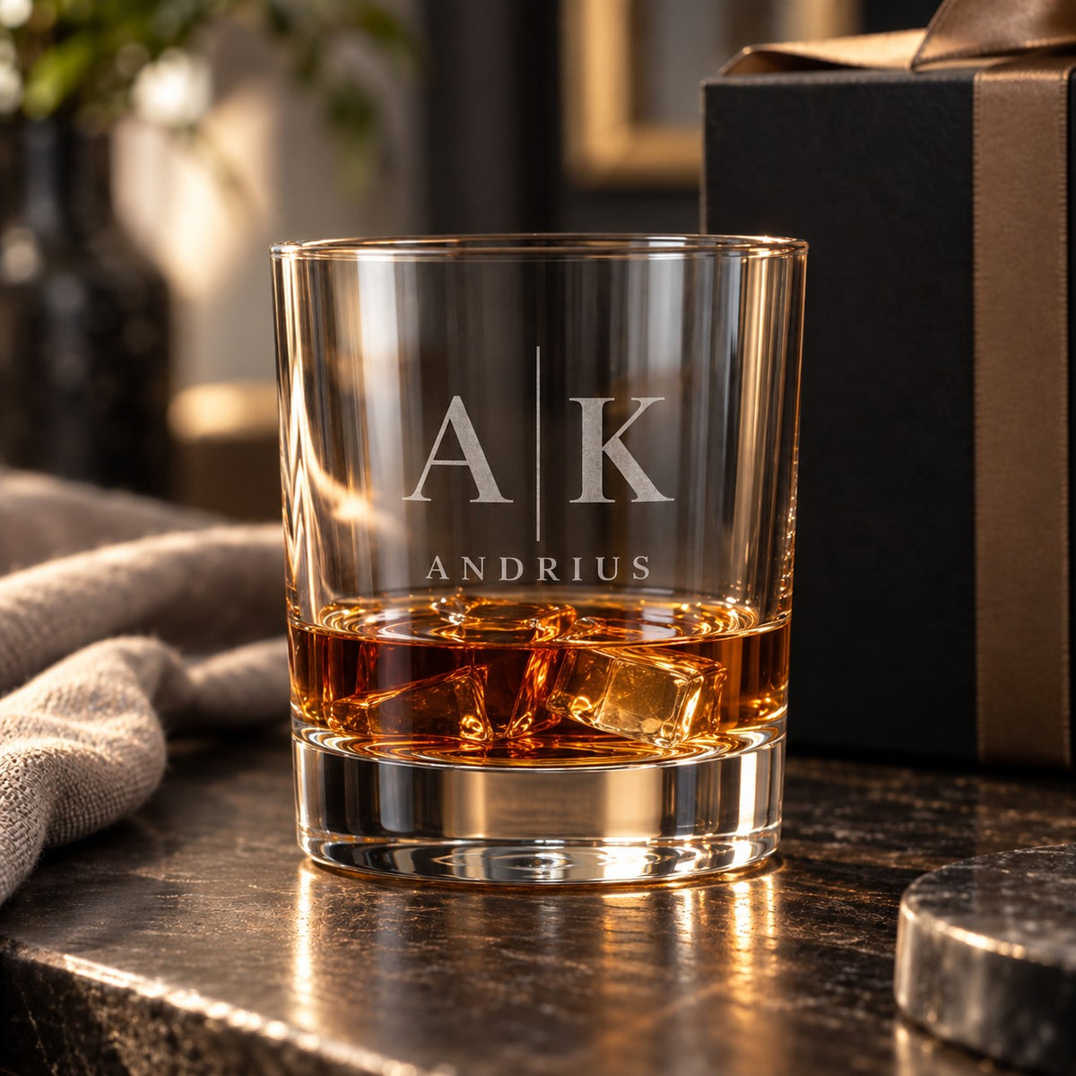 Whisky glass engraved with the monogram “A | K” and the name “Andrius”